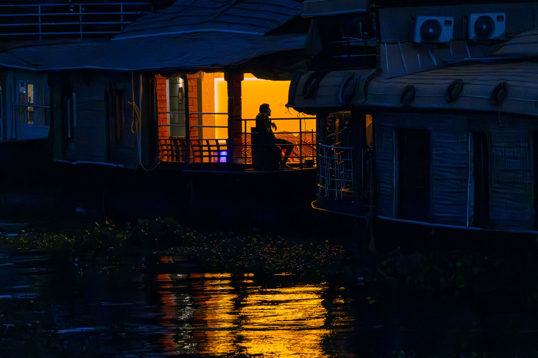 Houseboat At Blue Hour With Lit Doorway